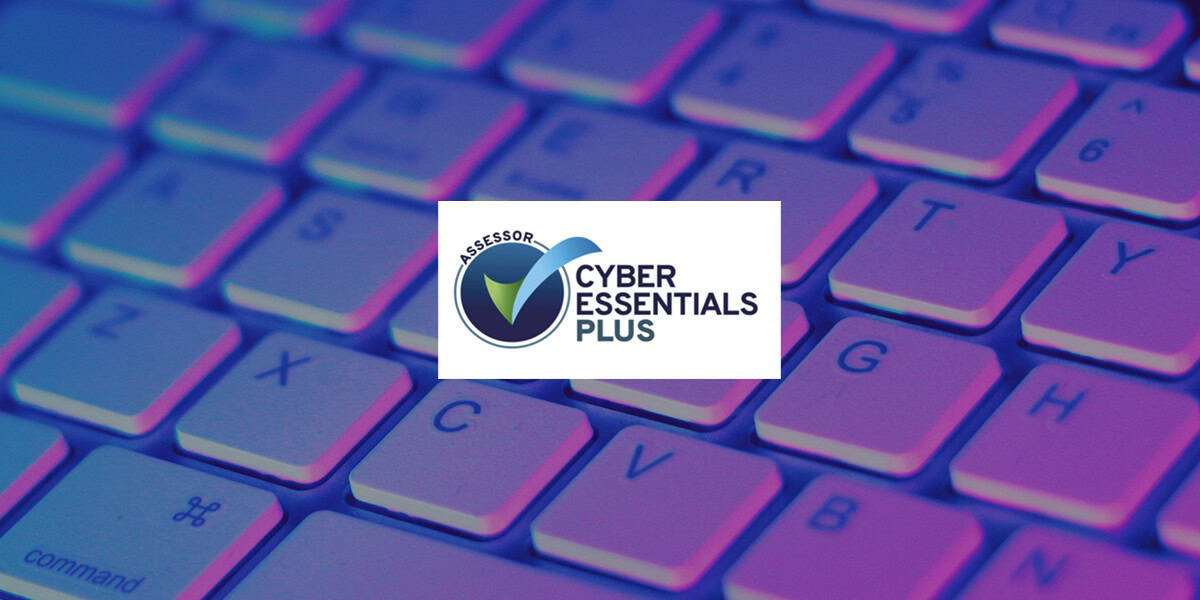 cyber essentials plus assessor logo over purple keyboard